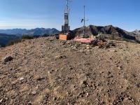 Looking south-southwest on Mount Baldy at the weather telemetry sensors and ski patrol equipment.