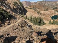 View of switchbacks in the descent from the saddle bewteen Sugarloaf and Devil's Castle. Cecret Lake in center.