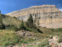 View of The Shoulder (left) and Mount Timpanogos (right). If you look closely, you can see the white metal shelter at the peak.